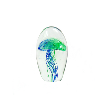 The Nemo 12cm is a stunning glass dome shaped art piece, expertly handcrafted with a bi-colour jellyfish design in bright blue and green. Its 12.5 cm height and 23.5cm circumference make it a solid and eye-catching addition to any space. This unique piece also glows in the dark, adding to its fascination as a glass art object.UNIQUE INTERIORS.