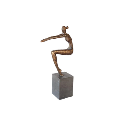 This GYMNASTIC GIRL ON STAND measures 34x8x18cm, providing an ideal size for decorative display in any room. Crafted with intricate details and lifelike pose, it's a perfect addition to any gym or sports-themed decor. Bring the beauty and grace of gymnastics to your home or office with this stunning statue.UNIQUE INTERIORS.