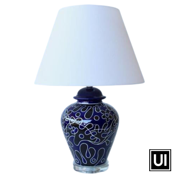 Introducing our navy and black lamp with a stunning crystal base and off-white shade from Unique Interiors. Standing at 60cm tall and 42cm in diameter, this lamp is crafted to perfection using the highest quality ceramic and glass materials.