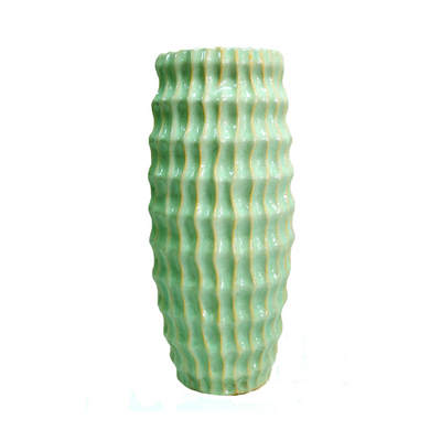 Our Atlantis vase is a stunning piece of home decor, crafted with a beautiful lime green glaze to bring an eye-catching look wherever it is placed. This ceramic vase features an elegant shape that lends itself to both decorative and functional use.