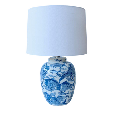 Blue & white fish lamp base off white shade 605x46cm  Introducing our Blue & White Fish Lamp Base from Unique Interiors, a stunning piece that will add a touch of whimsy to any room in your home. This lamp base is expertly handcrafted to perfection, ensuring the highest quality of craftsmanship.