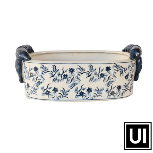 This blue oval planter adds a timeless touch to any space. Crafted from ceramic, it is 14x36x17cm in size and perfect for creating an elegant display for your plants. Its eye-catching shape and modern design will make it a standout in your home.  Unique Interiors, a place where you can find trendy decor that stays forever in style for any style.  Unique Interiors.