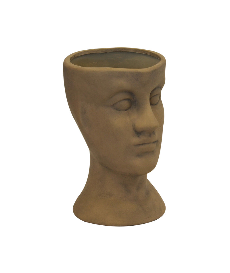 Ceramic head vase desert sand (30cm x 20cm)  Introducing the Ceramic Human Head Vase or Planter, a stunning addition to your home decor collection. This exquisite piece, created by Unique Interiors, features a beautiful desert sand color that complements any color scheme.  Crafted with the utmost attention to detail, this vase/planter measures 30cm in height and 20cm in width, making it the perfect size to hold your favorite plants or flowers.