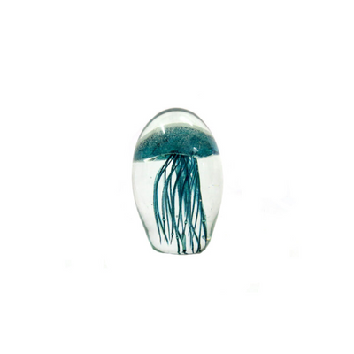 Introducing the Mejello 9.8cm, a stunning handmade clear orb featuring a teal jellyfish shape with silver bubbles and tentacles. With a height of 9.8cm, diameter of 7cm, and circumference of 20.5cm, this piece of glass art is a superb addition to any collection. Plus, it glows in the dark for added intrigue.UNIQUE INTERIORS.