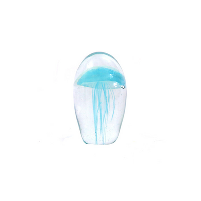 MONALUNA     A solid glass dome shaped object 12cm high with circumference of 22.5cm  Handmade this beautiful piece has within its clear depths a fascinating jellyfish shape with long tentacles in iced seablue  Glows in the dark. UNIQUE INTERIORS.