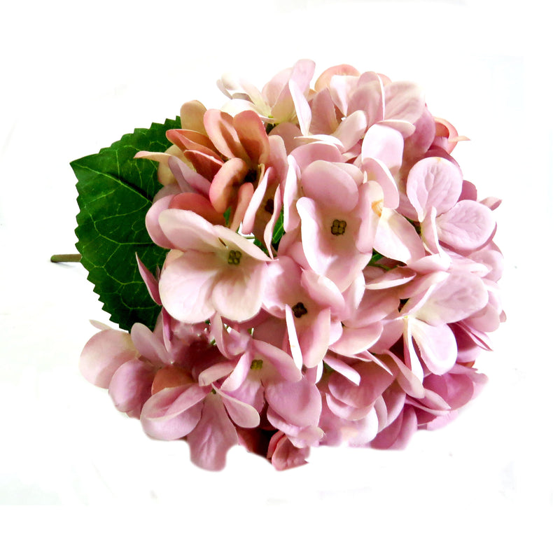 Experience the beauty of our Hydrangea Lilac Milkshake. With stunning pink and lilac touches, this 50cm large hydrangea head will add a touch of elegance to any space. Its well-proportioned size is sure to make a statement and elevate your floral arrangements-UNIQUE INTERIORS