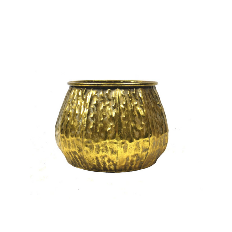The La Terra Vase is an expertly crafted antique gold metal container, perfect for displaying your favorite plants. With a 27.5cm diameter and 19.5cm height, it boasts a unique textural design and a lovely finish. Elevate your home decor with this one-of-a-kind piece. UNIQUE INTERIORS