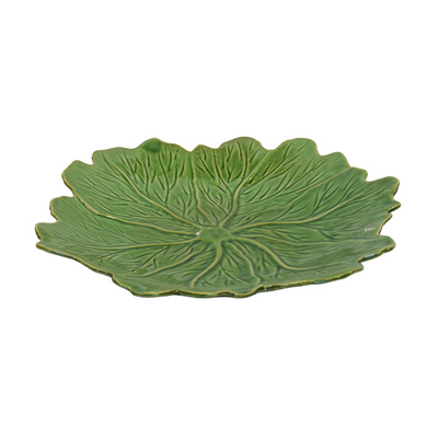 CERAMIC BORDELLO PLATE GREEN ROUND (40CM) Expertly crafted and made with high-quality ceramic, this 40cm round green plate from Bordello adds a touch of elegance to your dining experience. Its durable design makes it perfect for daily use, while its vibrant color adds a pop of personality to any table setting. Elevate your meals with this beautiful and functional plate. Delivery 5 to 7 working days