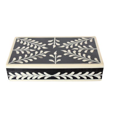 BLACK & BONE FLORAL OBLONG BOX 5X23X13CM This sleek and stylish BLACK & BONE FLORAL OBLONG BOX is the perfect addition to your home decor. Measuring 5X23X13CM, it is perfect for storing small items or as a decorative piece. The black and bone floral design adds a touch of elegance to any room.     Delivery 5 to 7 working days