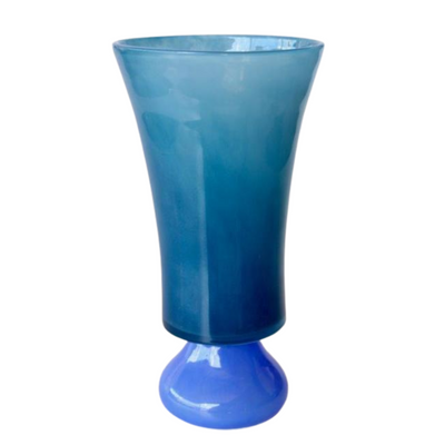 TALL 2 TONE BLUE GLASS VASE 34X18CM This expertly crafted TALL 2 TONE BLUE GLASS VASE 34X18CM adds a vibrant touch to any space. Made with precision, its unique design and high-quality material make it a perfect addition to your home decor. With a height of 34cm and a width of 18cm, this vase is ideal for both displaying your favorite flowers or as a standalone piece. Elevate your interior design with this beautiful vase.  DELIVERY 5 to 7 working