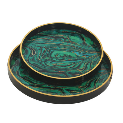 GLASS TRAY ROUND TURQUOISE S/2 Expertly crafted and beautifully designed, this set of two round turquoise glass trays adds a touch of elegance to any room. Perfect for serving or displaying items, these trays are a must-have for any host or hostess. Made with high-quality glass, they are both durable and stylish.  45CM X 45CM X 4CM  35CM X 35CM X 4CM     Delivery 5 to 7 working days   