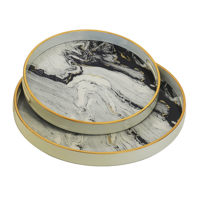 GLASS TRAY ROUND WHITE INK SET OF 2 Expertly crafted in a sleek round design, the GLASS TRAY ROUND WHITE INK SET OF 2 adds a touch of elegance to any table setting. Made with high-quality glass and a stunning white ink finish, this set of two trays is perfect for serving appetizers or displaying decorative items. Elevate your hosting game with these beautiful trays.  45CM X 45CM X 4CM  35CM X 35CM X 4CM     Delivery 5 to 7 working days