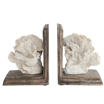 PAIR NATURAL CORAL BOOKENDS 17X14CM Crafted from natural resin, these 17x14cm bookends feature a unique and elegant coral design. With their sturdy construction and beautiful aesthetic, these bookends not only provide organization and stability to your bookshelf, but also add a touch of natural beauty to your home decor. A must-have for any book lover or interior design enthusiast.  DELIVERY 5 to 7 working