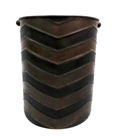 "Experience the sleek and sophisticated design of our Dark Shadow Container. Made with duo-toned metal in black and dark coffee colors, this container measures 26CMD X 32CMH. Its stylish appearance is perfect for displaying your plants and adding a touch of modern elegance to any space." Unique Interiors.