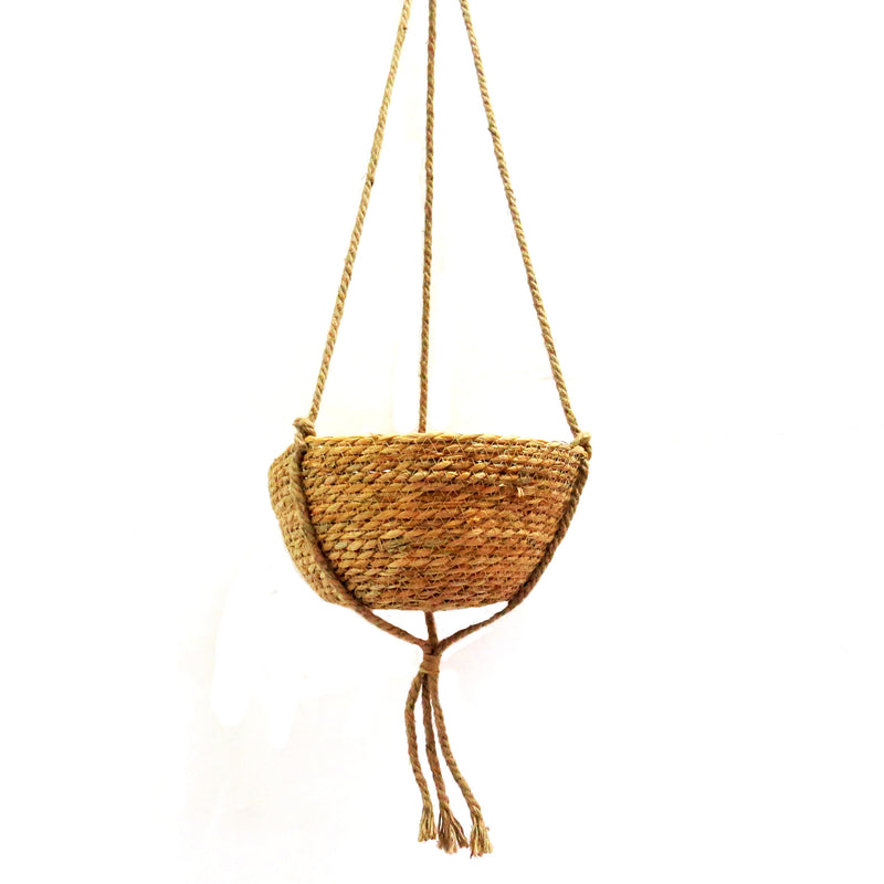 Enhance the appearance of your space with the Trapeze Hanging Basket. Measuring 30cm in diameter and 15cm in height, this basket is made of all natural materials and hangs securely with a 70cm long cord. Bring a touch of nature into your home with this versatile and stylish hanging basket-unique interiors