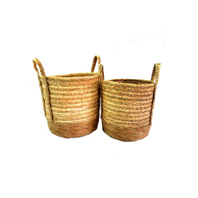 These Country Living Baskets are the perfect addition to your home decor. Made of natural, woven material in two different colors, they add a rustic charm to any room. The large basket is 32 cm in diameter and 29cm high, while the small basket is 27 cm in diameter and 27 cm high, making them both versatile and functional. With well-woven handles firmly attached on each side, these baskets are not only beautiful but also durable.UNIQUE INTERIORS.