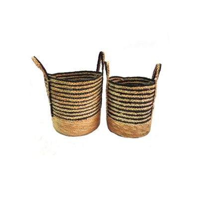 ntroduce natural and functional storage solutions to your home with the Resort House Baskets set. Made from natural materials, these woven baskets showcase black and natural color stripes. The 32 cm diameter large basket with sturdy handles measures 29 cm high, while the 27 cm diameter small basket measures 27 cm high. Perfect for organizing your space in style.UNIQUE INTERIORS.