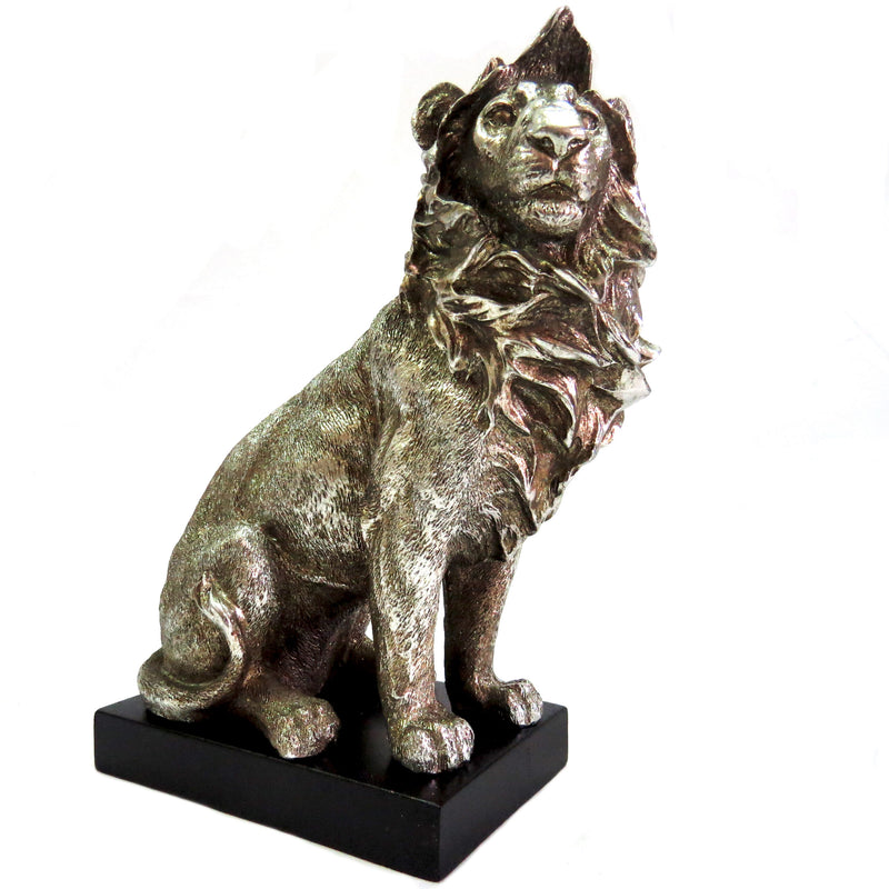 Introducing the Zimbo Lion - a stunning addition to any collection. This handsome antique silver lion stands at 12.5cm width and 15cm height on a black plinth, showcasing its beautifully formed and colored 630gms. A must-have for any lion enthusiast-unique interiors