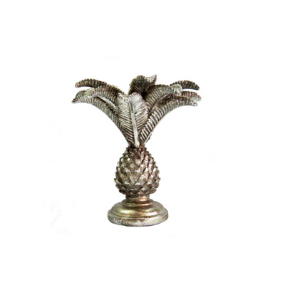 Elevate the ambiance of any space with our Jamboree Candleholder. Made of sleek silver with an intricate pineapple and palm design, this piece adds a touch of elegance to any room. Perfect for both practical and decorative use, it's a must-have for any candle enthusiast.UNIQUE INTERIORS.
