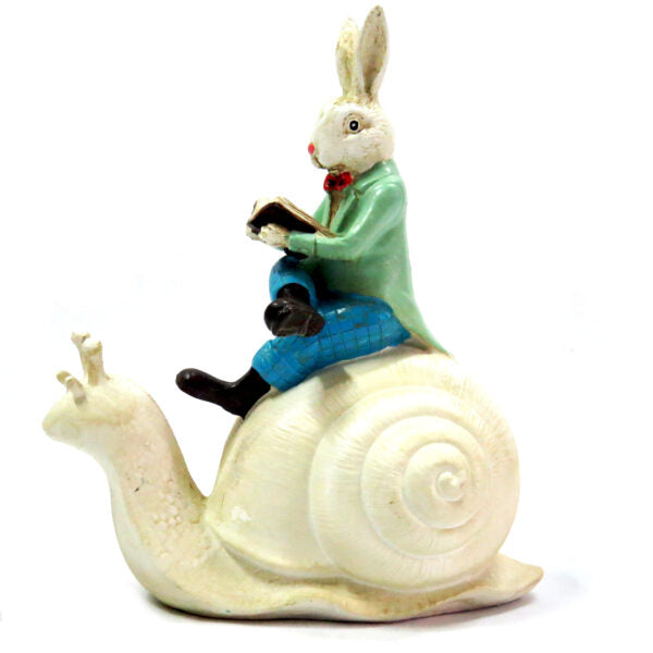 Discover the enchanting world of Speedo Rabbit with this 18cml x 10cmw x 21cmh handmade and handpainted art piece. Whimsical and exquisitely painted, this rabbit riding on his snail will transport you to Fantasy Land. Add a touch of magic to your home decor with this unique creation.UNIQUE IONTERIORS
