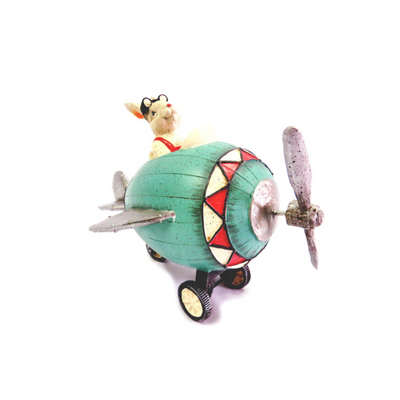 The Maverick Rabbit is a handcrafted and handpainted figurine measuring 24cm x 16.5cm x 17cm. This beautifully constructed rabbit is sitting in a plane with moving wheels, complete with goggles pushed back on his forehead. With its heavy and sturdy design, this item is sure to take off and make a charming addition to any collection.UNIQUE INTERIORS.