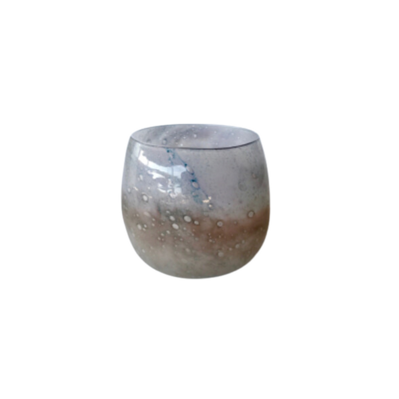 Beige shimmery glass candle holder 20X17cm  This beige glass candle holder boasts a shimmery finish and measures 20x17cm, perfect for adding a soft touch and a hint of warmth to any setting. The timeless design of the glass holder is ideal for dinner parties or special occasions, adding a touch of sophistication to any event.     Delivery 5 - 7 working days