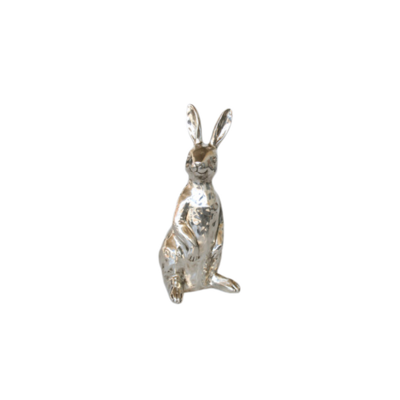 Make a statement with this stunning Medium Silver Sitting Rabbit! Beautifully crafted with silver detailing, this piece adds a unique and striking touch to your decor collection. It&