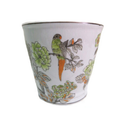This Tahiti pot is crafted using high-quality porcelain and is handpainted with beautiful green leaves on a white background for a simple yet stunning design. Perfect for adding a touch of style to any home.UNIQUE INTERIORS