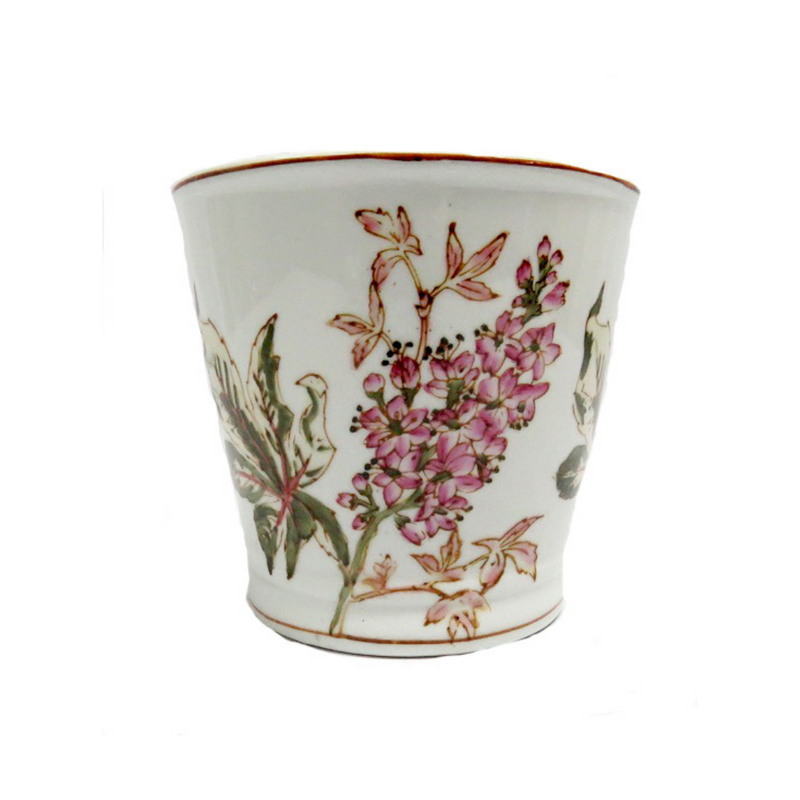 This Wildflower Planter features a beautiful handpainted design in pinks and greens on a porcelain pot that measures 17.5CMD in diameter and 15.5CMH in height. Add a touch of elegance to your garden or interior space with this unique and charming planter.UNIQUE INTERIORS