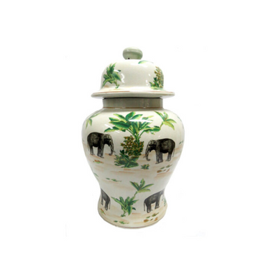 The Palm Elephant Jar Large boasts a breathtaking design featuring an intricate hand-painted elephant and palm tree pattern on porcelain. With vibrant colors and a detailed design, this jar is a stunning addition to any space. UNIQUE INTERIORS.