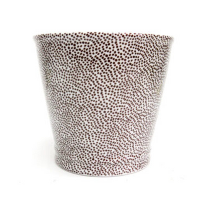 Ideal for adding a dash of African flair to your interior, the Serengetti planter is a small spotted planter with subtle accents. It measures 17.5cm in height and 16cm in width, making it perfect for adding a unique touch to any room.UNIQUE INTERIORS.