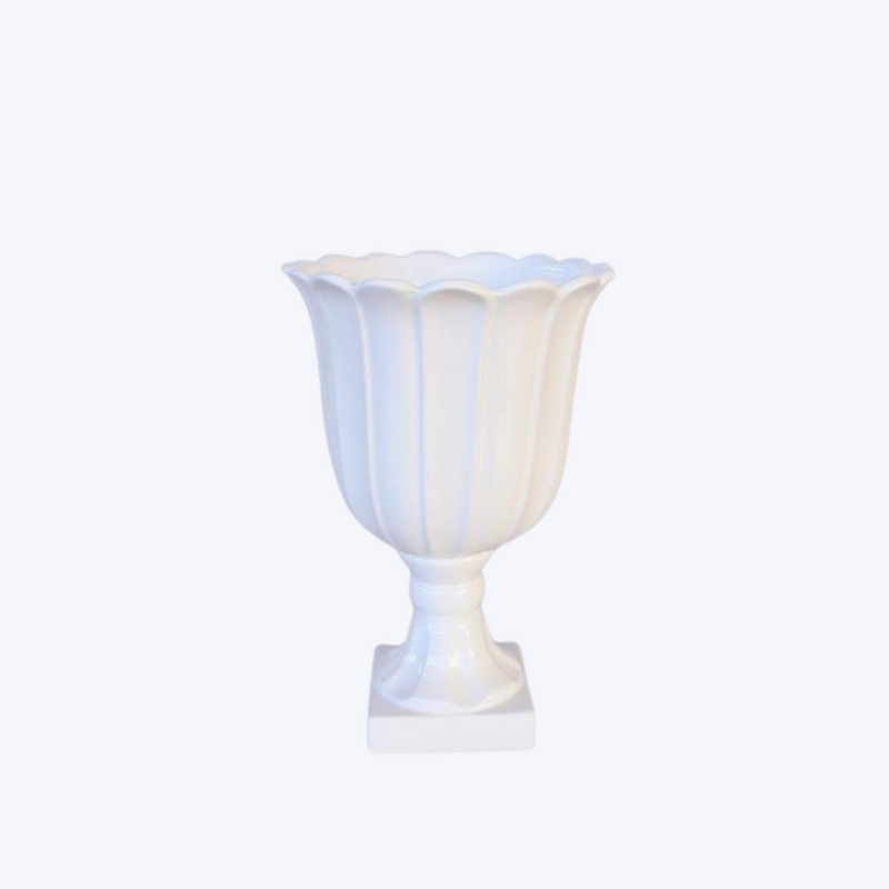 This medium-sized white vase or urn, measuring at 35X24CM, is versatile and elegant. Perfect for displaying flowers or as a stand-alone piece, it adds a touch of sophistication to any room. Crafted with high-quality materials, it is durable and timeless. <span style="font-size: 0.875rem;">Display your favorite flowers or use it as a standalone statement piece. The possibilities are endless. Unique Interiors