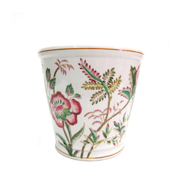 Introducing the Memories Pot - a beautifully handpainted porcelain pot featuring a delicate and charming design in shades of pink and green. Measuring 23CMD by 22CMH, this pot is the perfect addition to any home or garden. Add a touch of elegance to your space with this stunning piece. Uique Interiors
