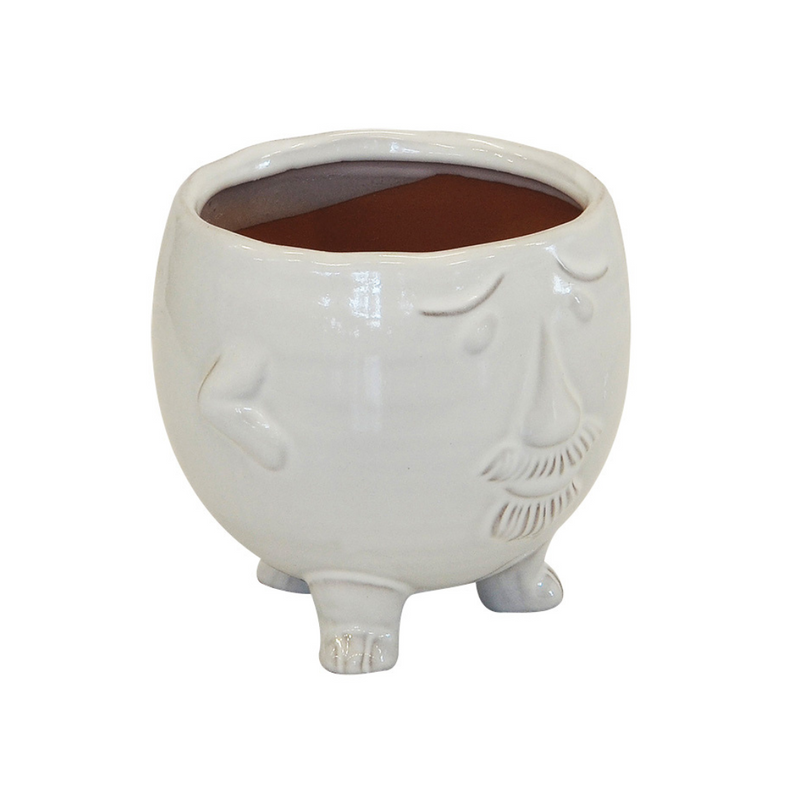 This classic ceramic face pot is perfect for sprucing up any living space. Its large size (15cm x 14cm) and striking white build make it an eye-catching addition to any room. Its versatile design allows it to be placed on a table, shelf, or even the floor. Enjoy its timeless beauty and elegance while never having to worry about replacing it.  DESCRIPTION  Ceramic face pot white large (15cm x 14cm)  Keep your home beautiful and in mint condition with this gorgeous vase  Delivery 5 - 7 working days