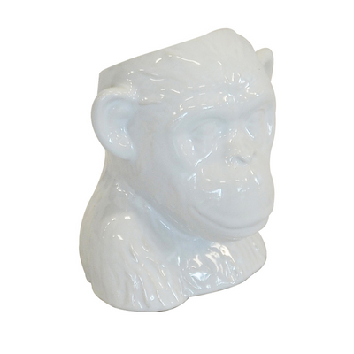 This 16CM (H) X 15CM (D) porcelain Ceramic monkey head planter pot is a unique interior decoration piece to liven up any space.  Ceramic monkey head white  Size  16CM (H) X 15CM (D)  Ceramic porcelain decor planter pot.  Unique Interiors