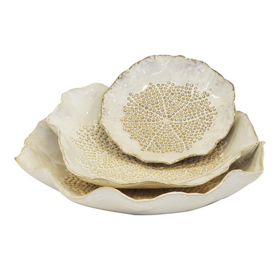 Add a touch of uniqueness and beauty to your home with this set of 3 ceramic petal plates. Each plate boasts a distinct flower petal shape, with sizes ranging from 28cm x 28cm for the large plate, 25cm x 25cm for the medium plate, and 17cm x 17cm for the small plate. Perfect for any interior decor, these plates are sure to add a hint of elegance to your home.  Ceramic Petal Plate White Set of 3. 