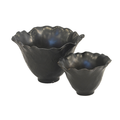 Ceramic scalloped petal votives in matt black come in a set of two, with dimensions of 18 cm (H) x 26 cm (D) and 12 cm (H) x 20 cm (D). These ceramic and porcelain decor planters bring an elegant and unique touch to any interior.  Ceramic scalloped petal votive matt black s/2  Size  18CM (H) X 26CM (D)  12CM (H) X 20CM (D)  Ceramic porcelain decor planter pot.  Unique Interiors