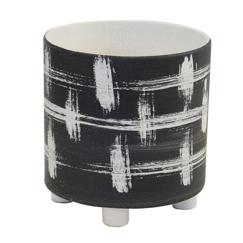 This ceramic tartan planter is presented in a black and white design. Measuring 26cm in both height and depth, it offers a distinct aesthetic to any interior.  Ceramic tartan planter black & white   Size  26CM (H) X 26CM (D)  Unique Interiors 