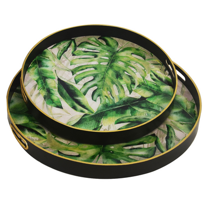 Enhance the look of your living room or bedroom with this set of two Glass Tray Foliage. The larger tray, measuring 60cm, and the smaller one, measuring 50cm, display a stunning foliage motif that can easily be matched with any interior style. Perfect for entertaining, these trays are a must-have home decor item to add a unique, elegant touch.  Glass tray foliage s/2