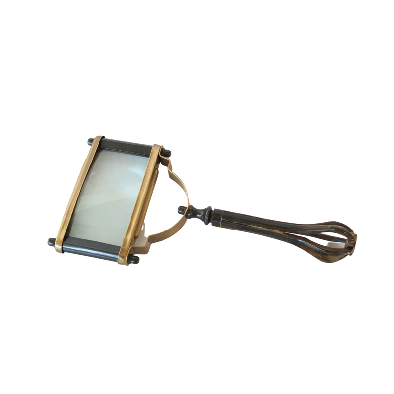 This magnifying glass is crafted from brass and wood, measuring 26x12.5cm, giving any home decor a unique and stylish aesthetic.  Delivery 5 - 7 working days