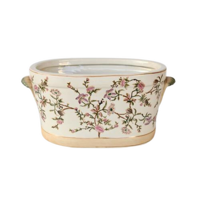 Large pink floral foot bath 22x45x28cm  This beautiful pink floral ceramic foot bath is perfect for pampering your feet! Its generous size (22x45x28cm) provides enough room for a thorough and luxurious foot soak. The decorative plant pot design adds a stylish touch to your bathroom that is sure to please.  Unique Interiors, a place where you can find trendy decor that stays forever in style for any style.  Unique Interiors.  Delivery  5 to 7 working days.