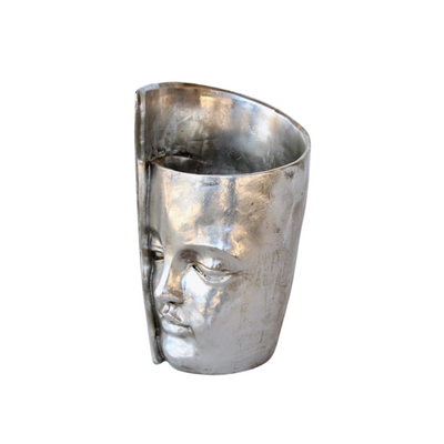 This Large Silver Twisted Face Planter is a unique and eye-catching addition to any home. Crafted with a stylish twisted face design, this planter measures 32x17cm, perfect for showcasing your favorite plants. It makes a great gift for the plant lover in your life.  Delivery 5 - 7 working days