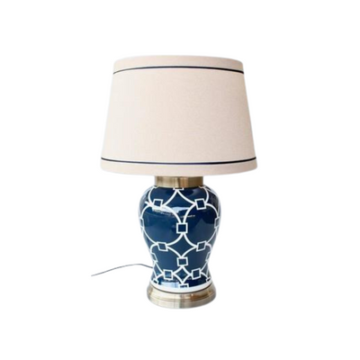 Add a unique touch to any room with this handmade navy and white geometric lamp linen shade. Expertly crafted, this 70cm-high lamp will brighten any area with its eye-catching design. Perfect for both modern and classic settings, it's sure to be a striking accent.  Delivery 5 - 7 working days