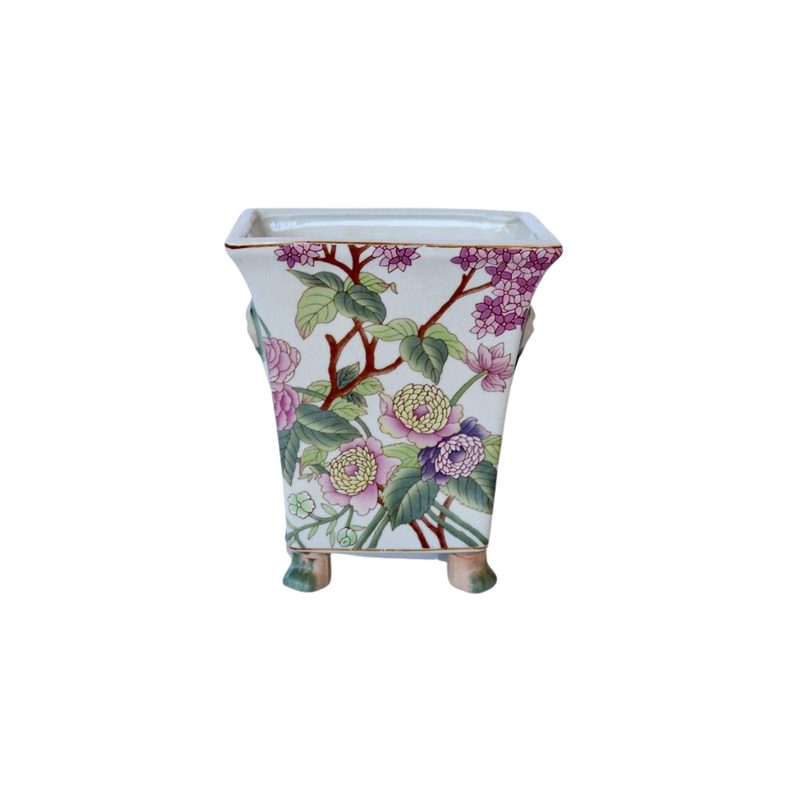 This footed planter will enliven any home with its stunning pink floral design. Measuring 20X18X14CM, its size is ideal for a range of plants.  Delivery 5 - 7 working days