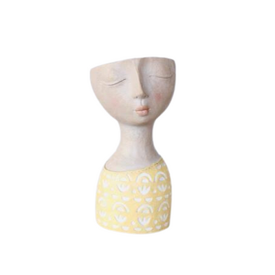 This Yellow Bust Flower Pot is an eye-catching addition to any home décor. Its distinctive design is sure to add a unique flair to any space. With 28X14CM dimensions, it's the ideal way to show off your creative flair.  Delivery 5 - 7 working days