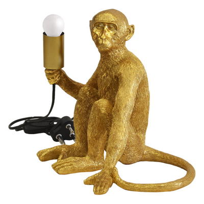 Resin monkey lamp x.large gold  Size  40CM (H)  A striking rich gold monkey table lamp for the perfect addition to your home.  Interior Decor Piece.  Ornamental lighting.  Unique Interiors   This 40CM (H) gold resin monkey table lamp adds a striking touch to any home decor. The unique design and ornamental lighting creates a beautiful and luxurious atmosphere. It is perfect for highlighting a special corner of the living space, creating a unique interior.