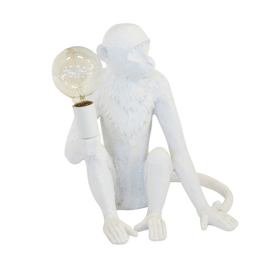 Make a statement in your home with this unique resin monkey lamp. Standing 40cm high, it serves as a beautiful ornamental lighting and interior decor piece. Its white color adds a subtle touch to any space while creating a unique and stylish atmosphere.  Resin monkey lamp x.large white  40CM (H)  A striking white monkey table lamp for the perfect addition to your home.  Interior Decor Piece.  Ornamental lighting.  Unique Interiors 