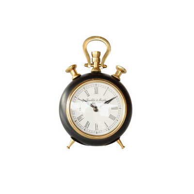 This small black and brass standing table clock is a unique piece to spruce up any room. With a size of 21X13cm, this clock is perfect for the study, as a gift, or whatever your heart desires. Add a touch of elegance and precision with this classic yet timeless design. Delivery   7 - 10 working days