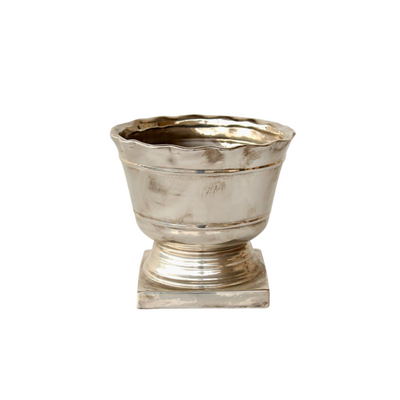  Silver planter on foot  This classic piece is the perfect accent to any room in your home. Its 25cm x 23cm size makes it ideal for lovers of potted plants.  Delivery between 5 - 7 working days