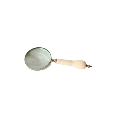 This silver magnifying glass is a luxurious addition to any home. Crafted with mother of pearl detail on the handle, it adds a touch of sophistication while making it easier to search for the finer things in life. Measuring 25 x 10cm, this magnifying glass is sure to be a treasured item for years to come. Delivery   7 - 10 working days